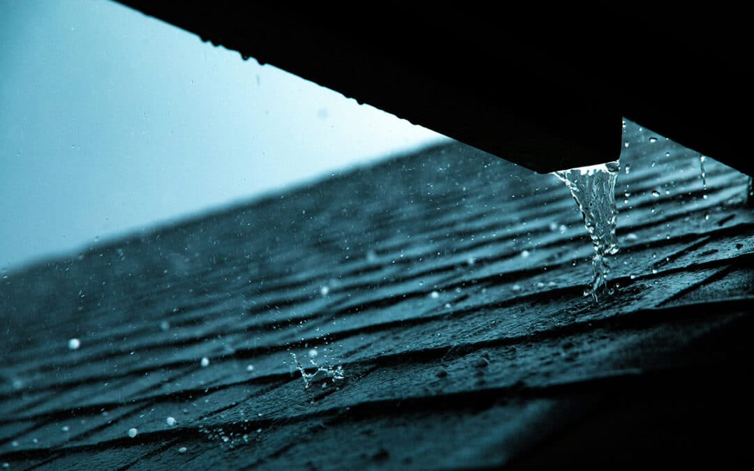 Roof Of A House In A Rain Storm With Gutters