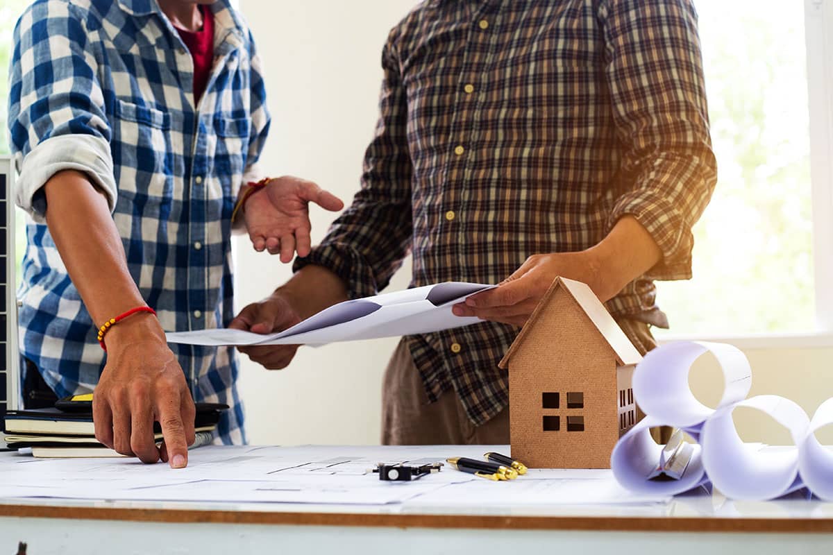 Contractors discussing building plans